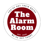 The Alarm Room logo with bold white text on a red circle and the slogan “You’ve got their backs — we’ve got yours” surrounding the emblem.